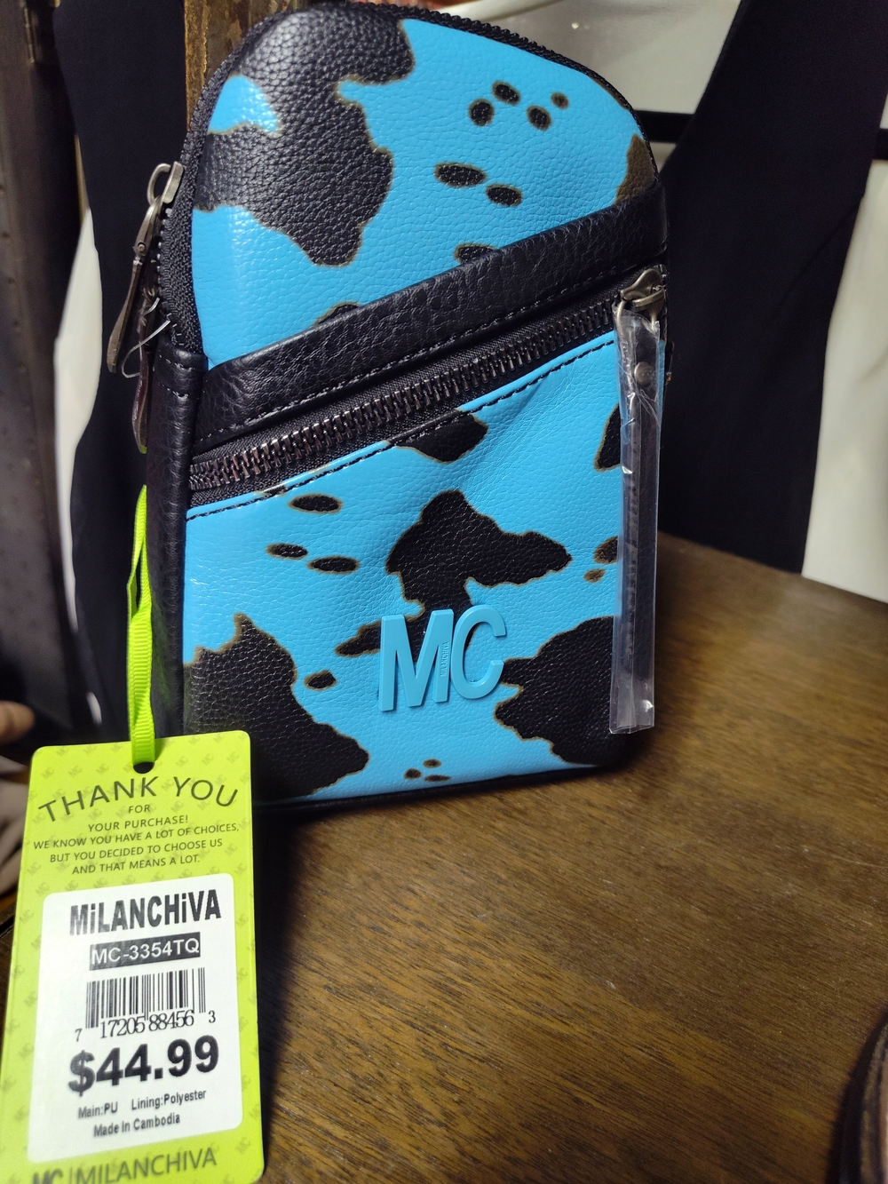 Turquoise & Black Cowprint Crossbody Sling/Backpack Combo Bag By Milanchiva